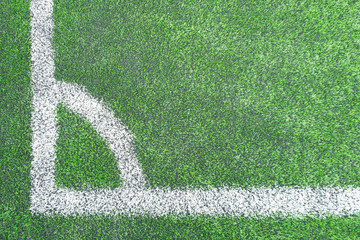 White corner line on the green football/soccer field from top view for background