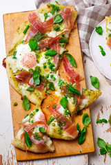 PEA PROSCIUTTO SPRING PIZZA . Top view. selective focus