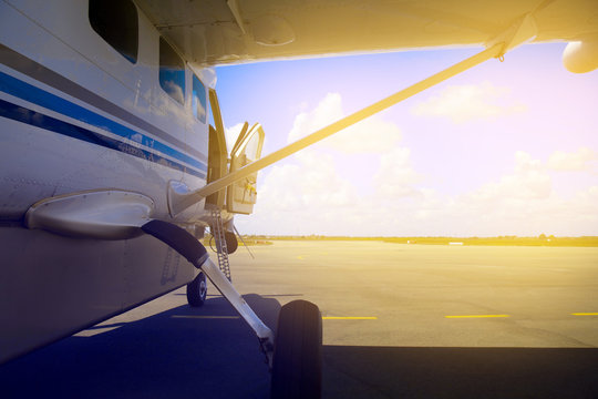 plane  stay on  runway with the open door. island of Zanzibar
