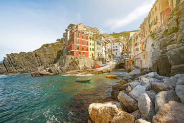 Fototapeta na wymiar Incredible landscape with rocks on the coast of Riomaggiore in Cinque Terre, Liguria, Italy, Europe in sunlight