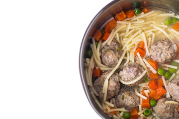 Soup with meatballs on white background