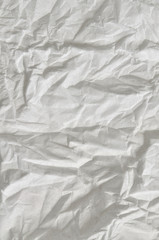 White Background texture / close up of a creased, white, soft paper texture, full frame, vertical