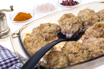 Meatballs with rice in glass baked