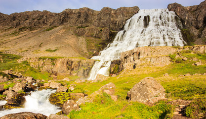 The magnificent summer view of Dynjandifoss (Dynjandi Waterfall), jewels of the Westfjords, Iceland. The biggest waterfall in Westfjords.