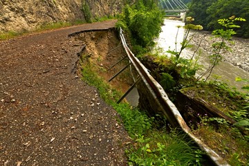Old collapsing abandoned mountain road