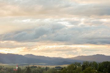 dramatic overcast sky sunset in mountains