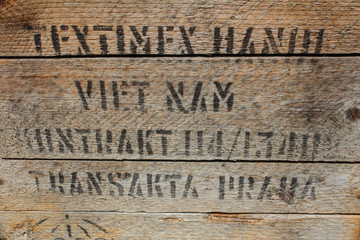 Rustic rough wood texture with black text