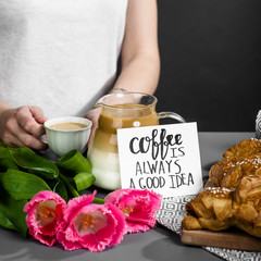 croissants cup of coffee and a bouquet of tulips