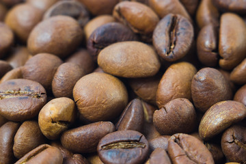 Fried coffee beans close-up. background
