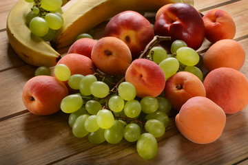 Naklejka na ściany i meble Assorted fruit on wooden table