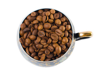 Coffee beans in a small cup on a white background. Isolated