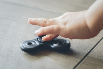 Fidget spinner and child hand