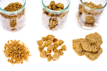 Different types of textured soy protein (meat) on white backgrou