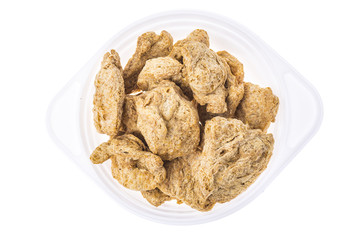 Raw dehydrated soy meat  on white background.