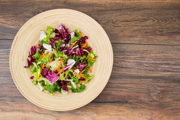Mix salads with pomegranate and ham