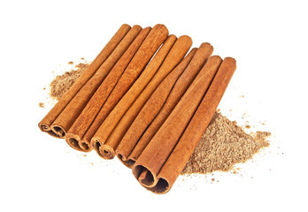 Cinnamon sticks with powder isolated on white background