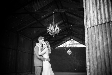 Beautiful bride and her groom on their wedding day looking happy and in love at the start of their marriage