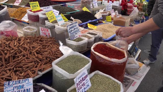 Pendik, Istanbul, Turkey - 17th of February, 2017: 4K Seller of spices offers to taste some