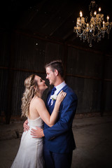 Beautiful bride and her groom on their wedding day looking happy and in love at the start of their marriage