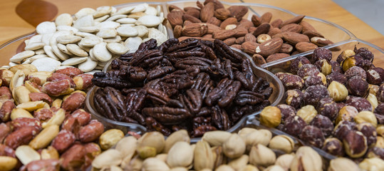Background from various kinds of nuts almond, hazelnut, cashew, Brazil nut