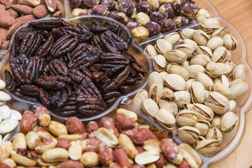 Background from various kinds of nuts almond, hazelnut, cashew, Brazil nut