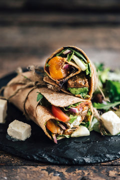 Tortilla wraps sandwiches with ground meat and vegetables salad,selective focus