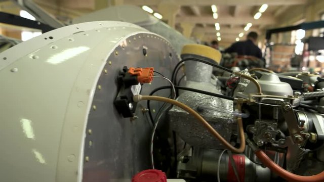 Aircraft engine close up. Pipes, wires and metal. Heart of a flying machine.