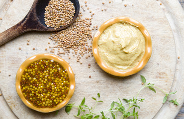 Mustard on wood with mustard seeds