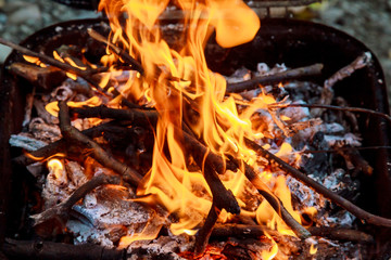 Vibrant and Bright Red Orange Flame Fire in Fireplace at Winter. Background