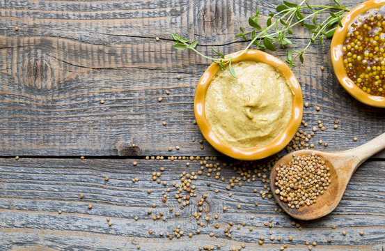 Fototapeta Mustard on wood with mustard seeds