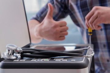 Repairman repairing broken color printer