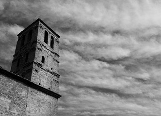 San Giuliano Church medieval bell tower with clouds in the ruined city of Faleria, near Rome (Black and White)