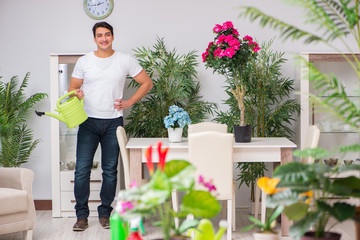 Young man in gardening concept at home