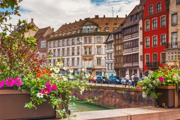 Fototapeta na wymiar Beautiful view of historic French town decorated with flowers. Strasbourg, Alsace, France