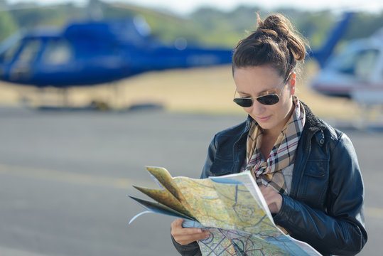 female pilot looking at the map