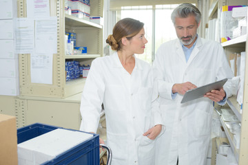 Fototapeta premium pharmacists discussing patients prescription