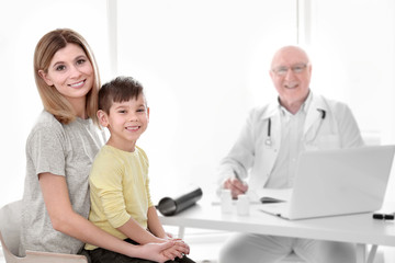 Little boy with mother at orthopedist's office