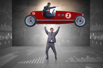 Businessman lifting sports car in power concept