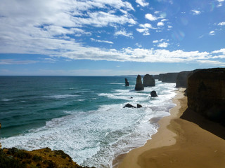 Twleve apostles in rough sea or ocean and endless blue sky with clouds