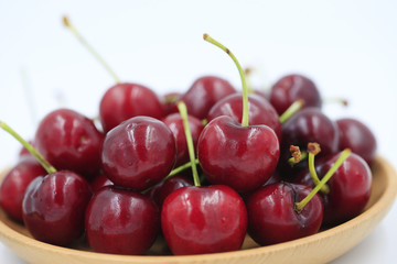 The big cherries are on a white background