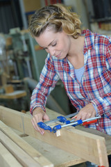 carpenter woman working in her workshop
