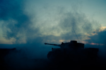War Concept. Military silhouettes fighting scene on war fog sky background, World War German Tanks...