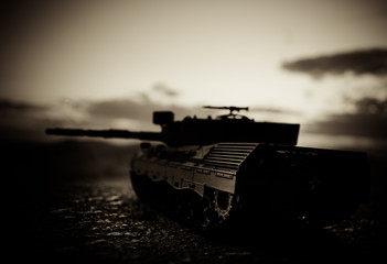 War Concept. Military silhouettes fighting scene on war fog sky background, World War German Tanks...