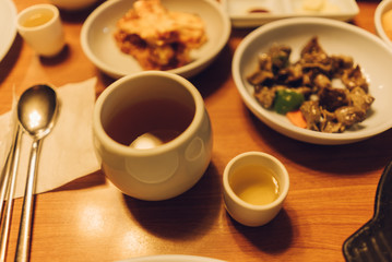 Obraz na płótnie Canvas Ginseng Sake served along side a Korean meal