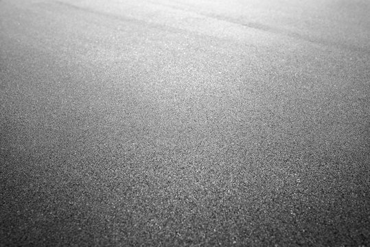 Asphalt background texture. New fresh asphalt black and white