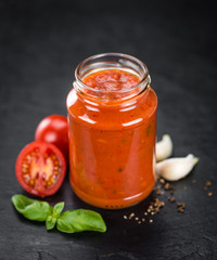 Fototapeta na wymiar Tomato Sauce on a slate slab (selective focus)
