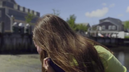 Girl Gives Friend Piggyback Ride Up Beach In Quaint New England Town (Slow Motion)