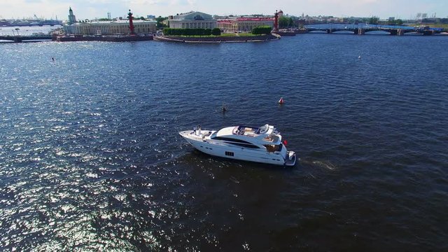 Luxury yacht in a city river with newlyweds aerial