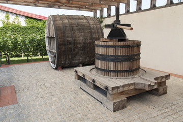 Grape harvest: old Wine press in a winery photo