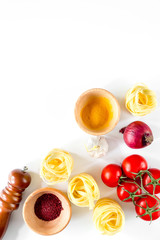 Preparing for cooking italian pasta white background top view copyspace